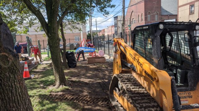 Construction crews install the musical playground at the East Passyunk Community Center