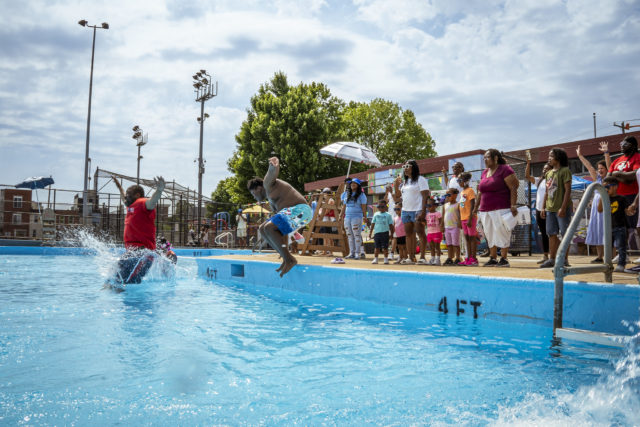 City Council President Kenyatta Johnson make a huge splash as he jumps in the pool. 