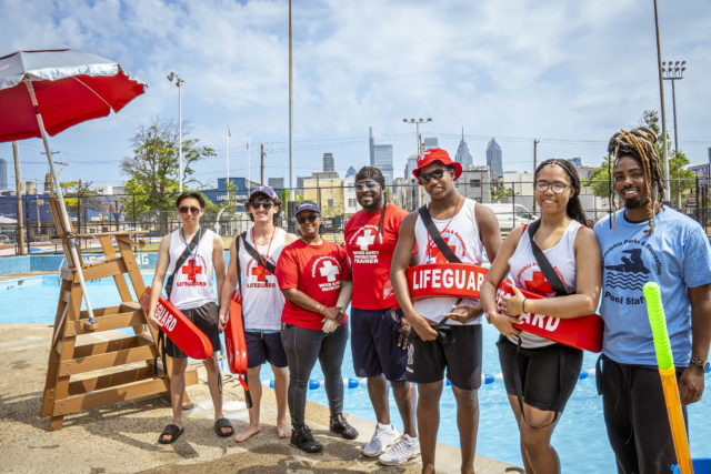Philadelphia Parks & Recreation lifeguards stand in front of the Chew Pool on June 17, 2024.