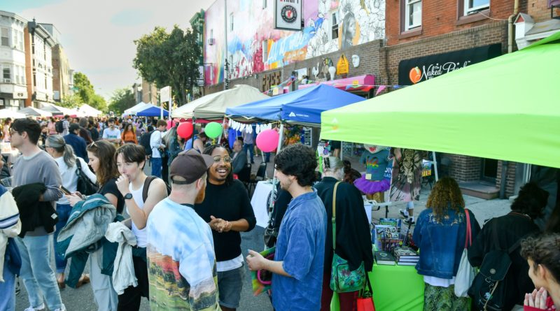 People attend Philly AIDS Thrift annual block party in Philadelphia. Annual street fair with music, family-friendly activities, over 30 vendors, and live performers.